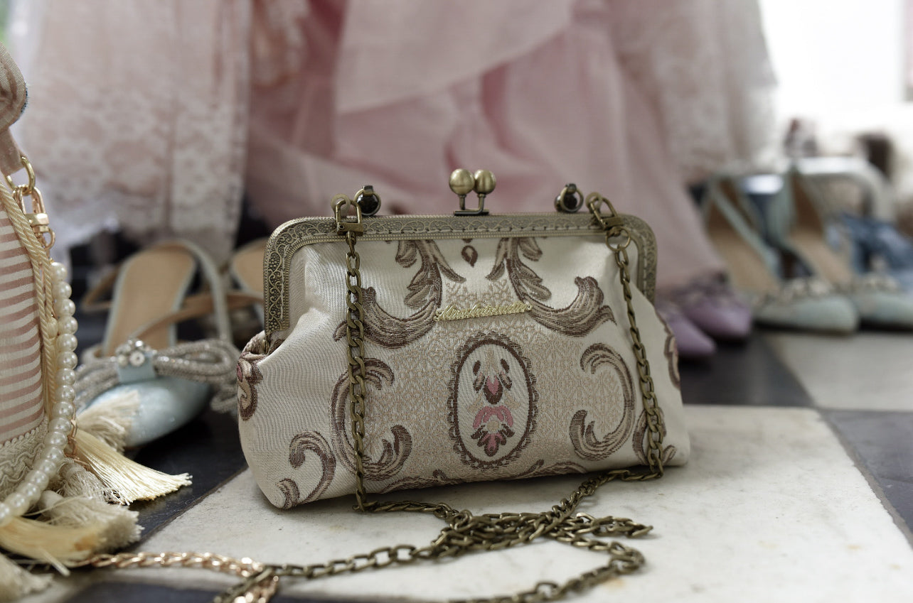 The Château Clasp Handbag